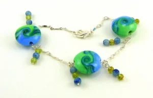 Wind and Water Lampworked Glass Bead Bracelet with Peridot and Blue Aventurine